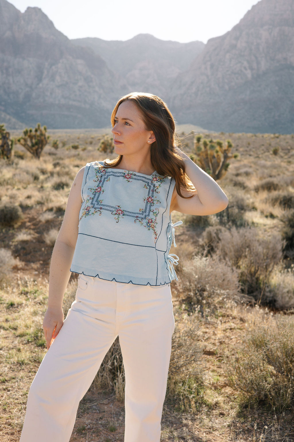 Chelsea standing outside in the desert