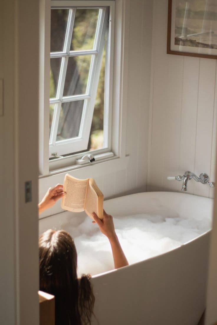 A book held above a bath